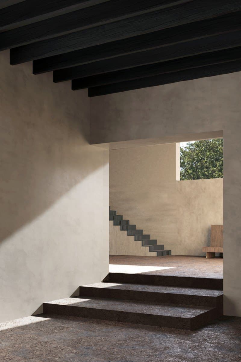Light falling across a sculptural concrete stair